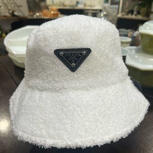 White fuzzy Prada bucket hat